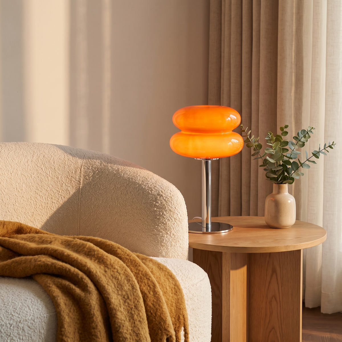 Vetra glass lamp beside a cream sofa